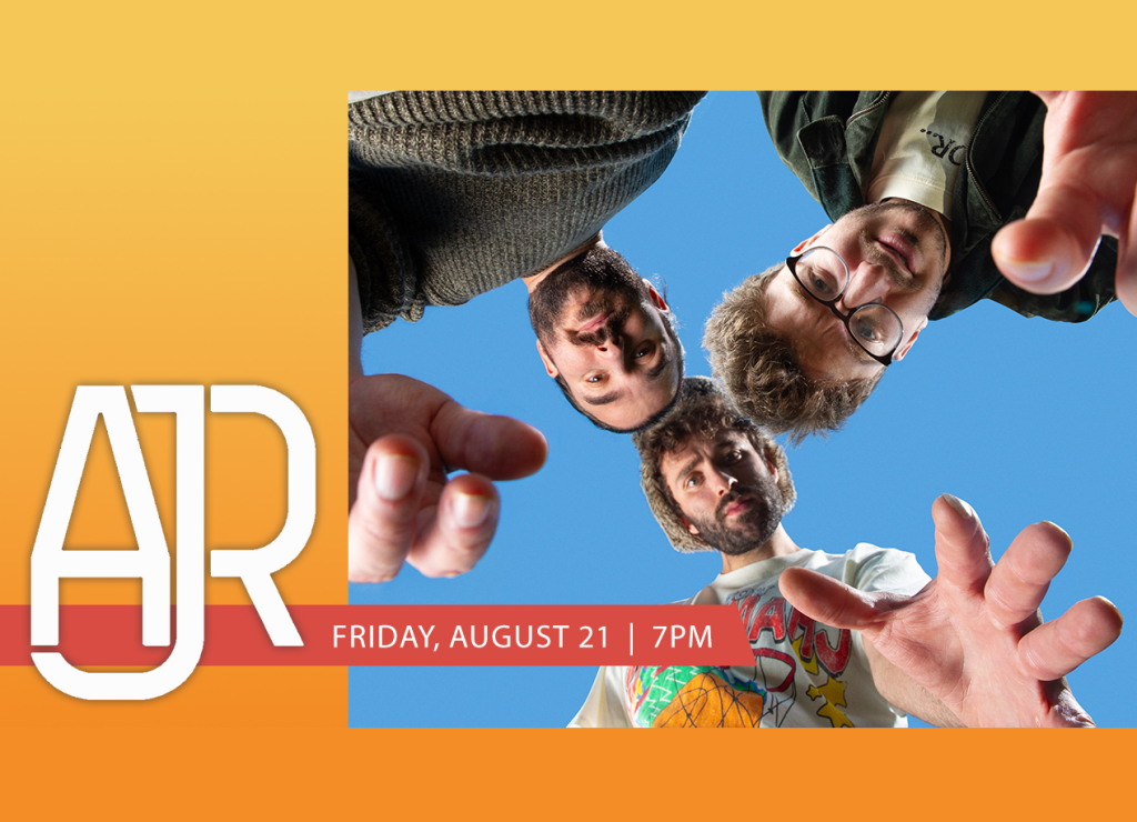 Four men with beards and glasses are pointing at the camera from a low angle against a blue sky background in Mat-Su, Alaska