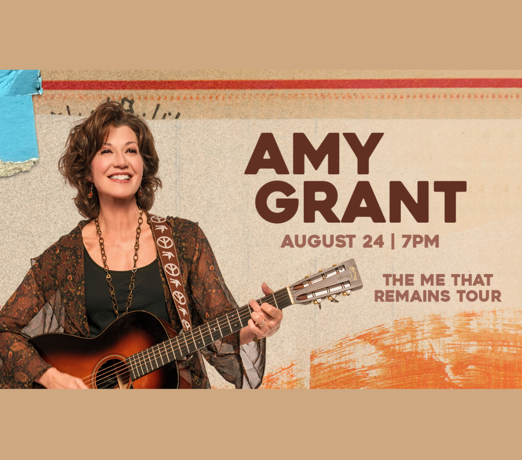 Amy Grant performs on stage with an acoustic guitar in Mat-Su, Alaska