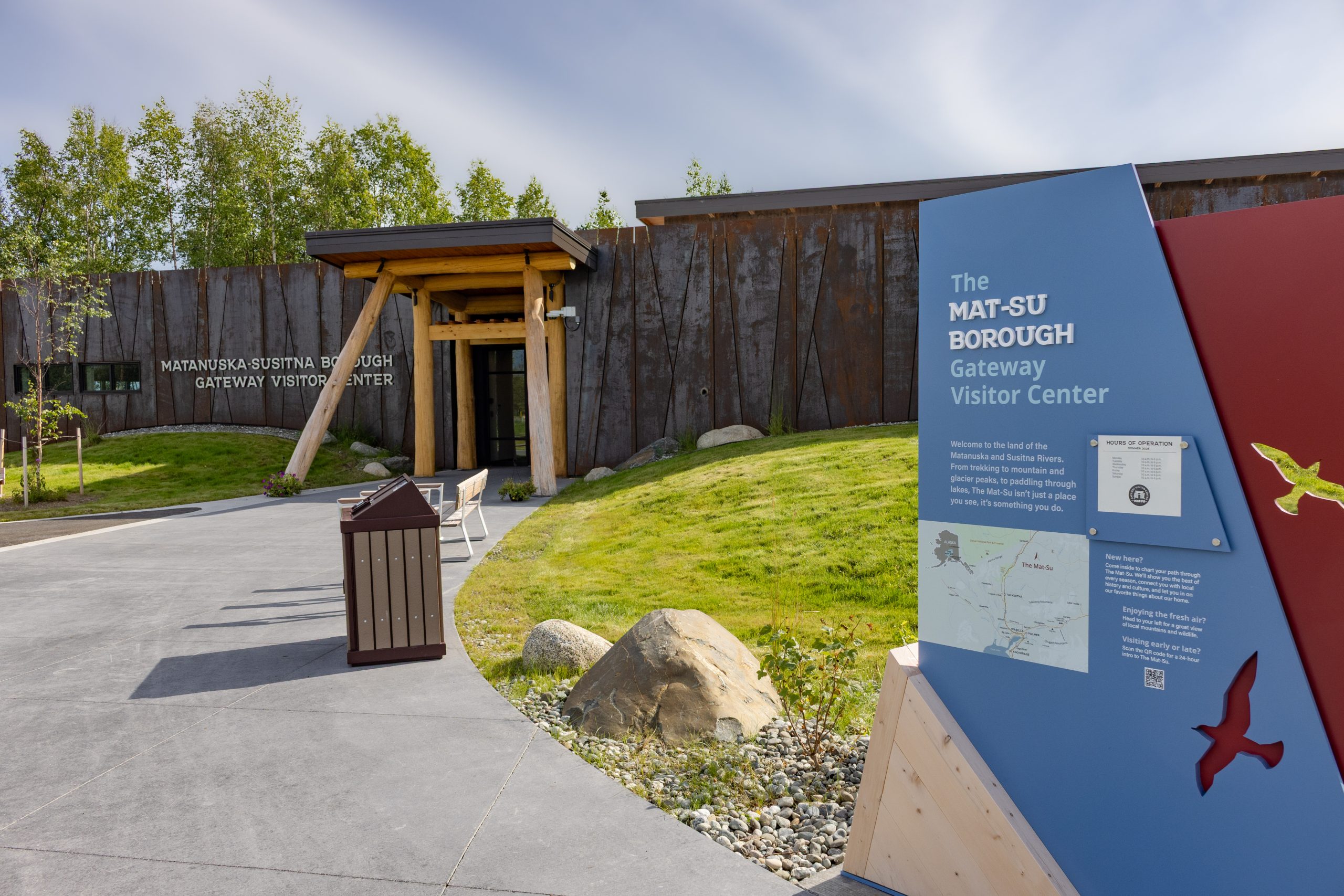 The Mat-Su Borough Gateway Visitor Center building with a sign in the foreground in Mat-Su, Alaska