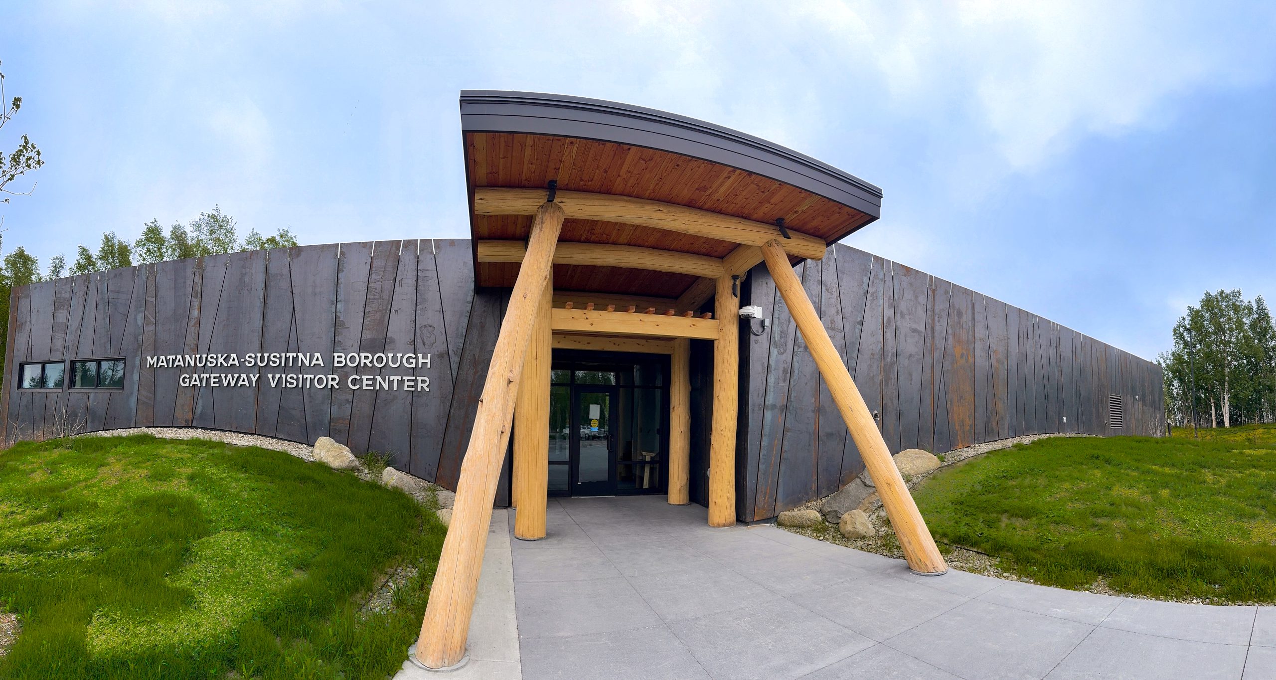 The Matanuska-Susitna Borough Gateway Visitor Center building with a wooden entrance in Mat-Su, Alaska